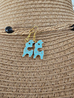 Pendientes de llama en rosa, azul, blanco y negro
